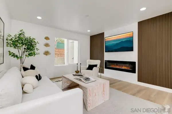 Living room with fireplace and slatted wood panels