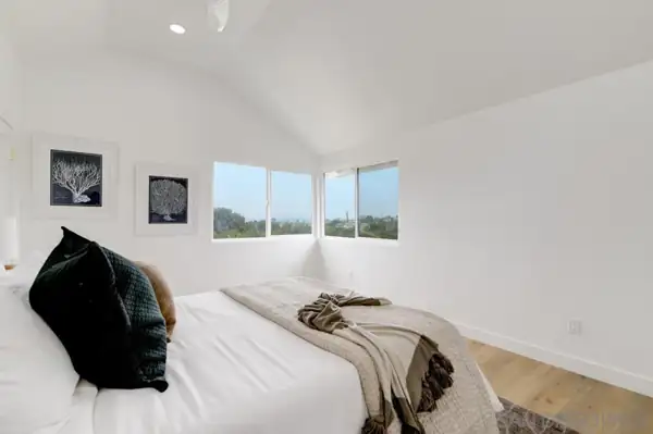 Bedroom with corner windows
