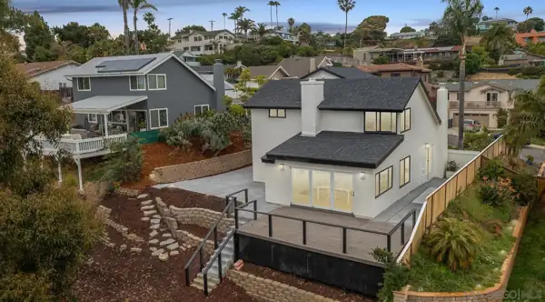 Aerial view of the rear of the home and deck