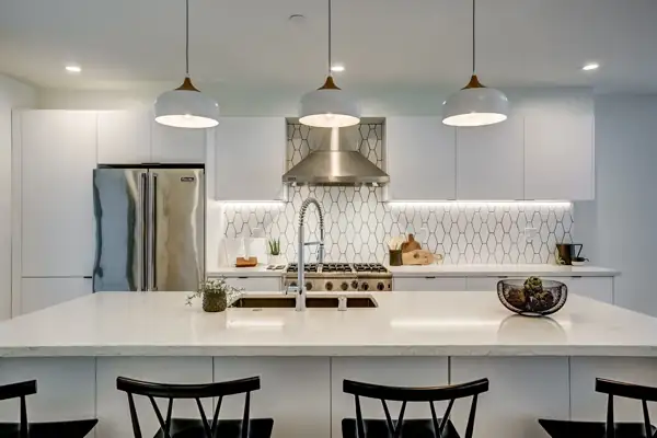 White kitchen with pendants over the island