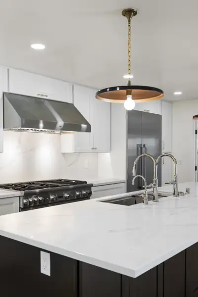 Kitchen range, hood and island faucets