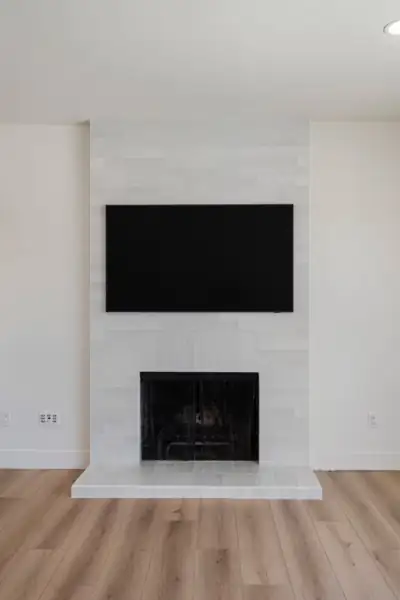 Living room fireplace with white tile surround