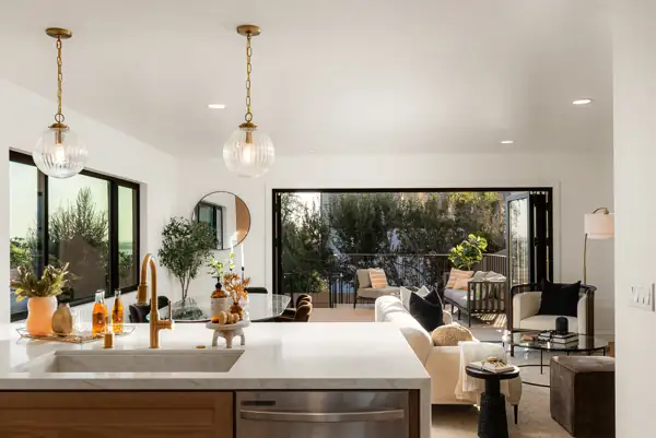 View over the kitchen sink to the living room and deck