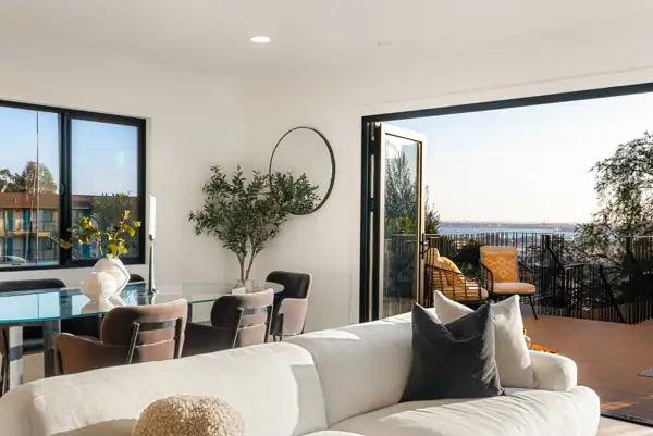 Dining and living area with bay view