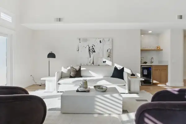 Living room sofa with wet bar beyond