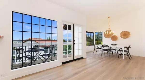 Rancho Bernardo: Living area with black-grid window, French doors and dining nook