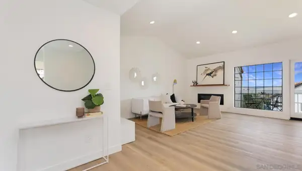 Entry and living room with vaulted ceiling